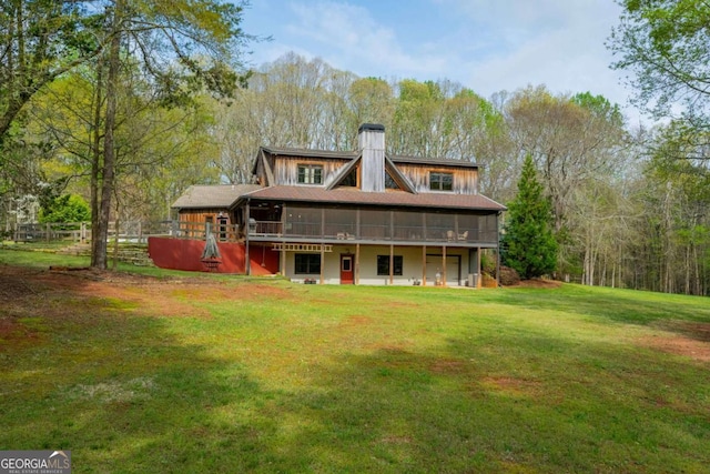 142 Holland Dam Dr, Maysville, GA 30558 - rear view of house with a lawn and a chimney