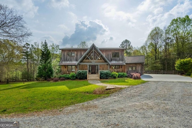 142 Holland Dam Dr, Maysville, GA 30558 - view of front of property featuring fence, a front lawn, and gravel driveway