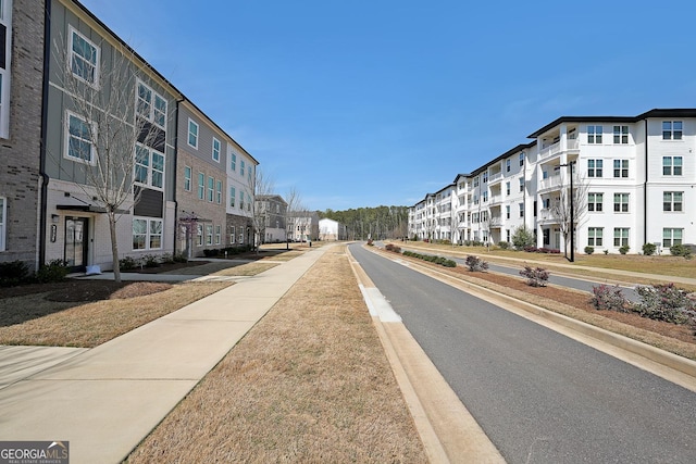 3323 Owl Creek Pkwy, Acworth, GA 30102 - view of asphalt road with curbs and sidewalks