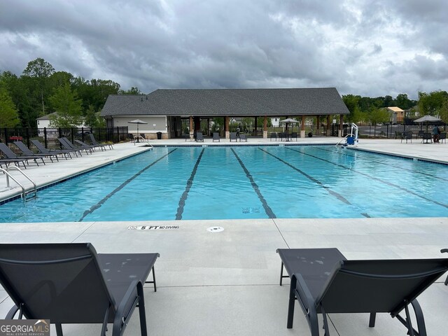 3323 Owl Creek Pkwy, Acworth, GA 30102 - community pool with fence and a patio area