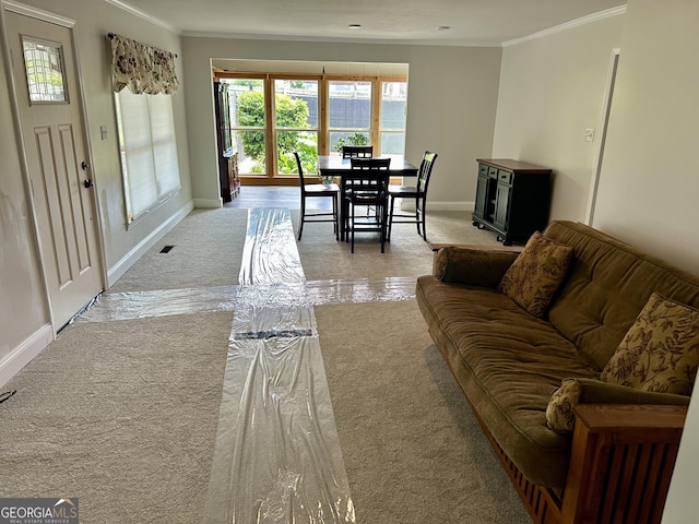 6121 N Main St SE, Acworth, GA 30101 - living area featuring crown molding, baseboards, and light carpet