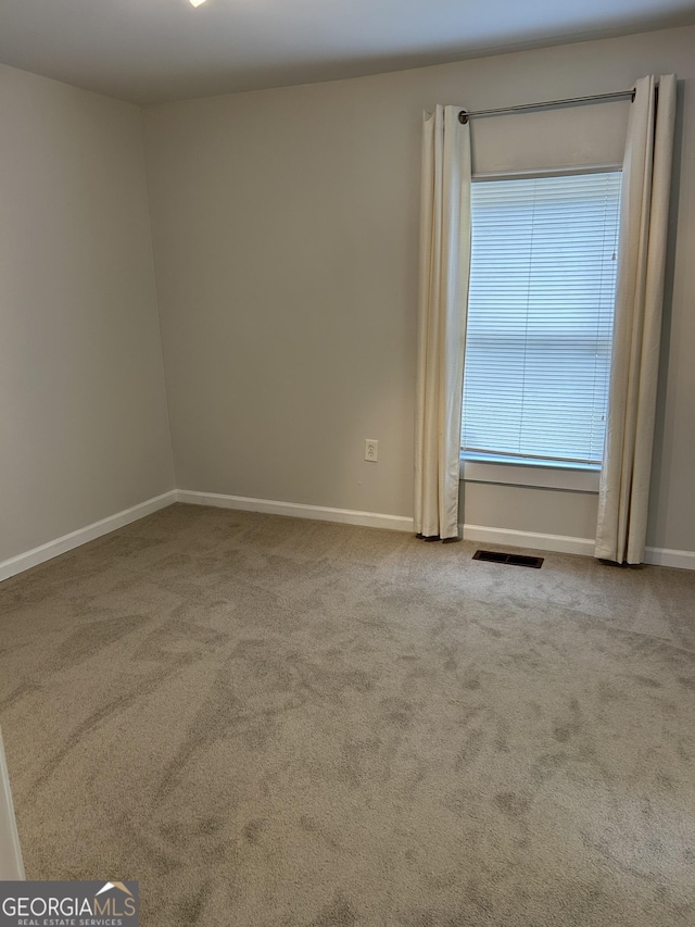 6121 N Main St SE, Acworth, GA 30101 - carpeted empty room featuring visible vents and baseboards