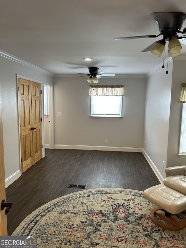 6121 N Main St SE, Acworth, GA 30101 - interior space with crown molding, dark wood-style flooring, ceiling fan, and visible vents