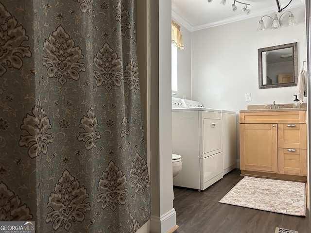 6121 N Main St SE, Acworth, GA 30101 - full bathroom with crown molding, vanity, separate washer and dryer, toilet, and wood finished floors