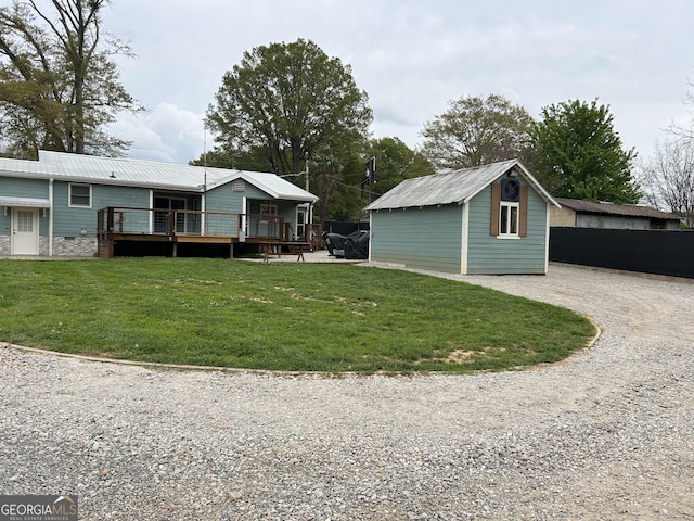 6121 N Main St SE, Acworth, GA 30101 - view of yard with a deck, driveway, and an outbuilding
