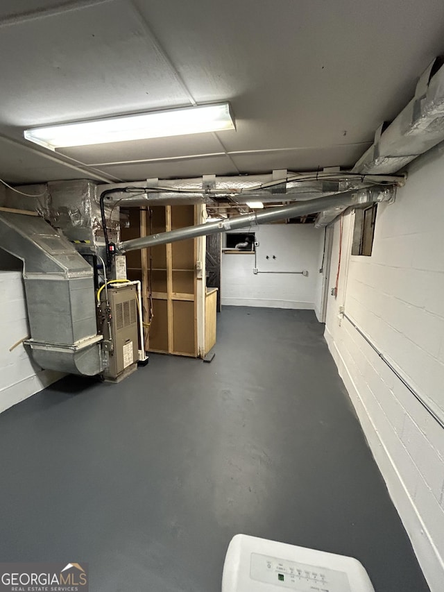 6121 N Main St SE, Acworth, GA 30101 - below grade area with heating unit and concrete block wall