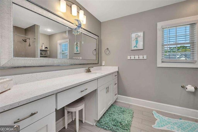 123 E Commons Dr, Saint Simons, GA 31522 - bathroom featuring vanity and tiled shower