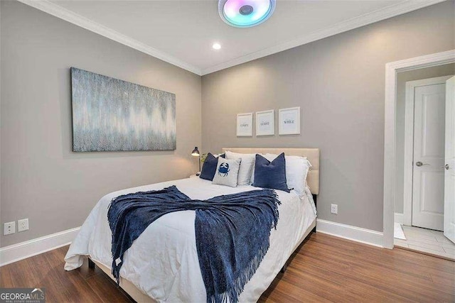 123 E Commons Dr, Saint Simons, GA 31522 - bedroom featuring wood finished floors, crown molding, and recessed lighting