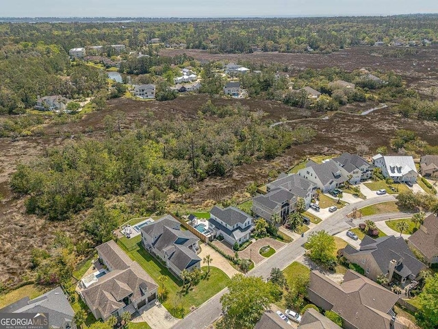 123 E Commons Dr, Saint Simons, GA 31522 - aerial view of property's location with nearby suburban area