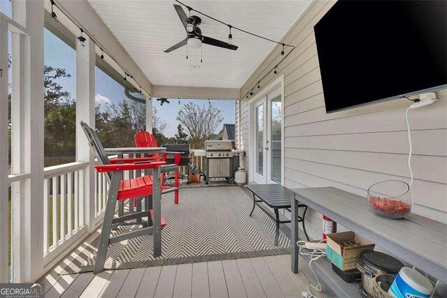 123 E Commons Dr, Saint Simons, GA 31522 - deck featuring area for grilling, a ceiling fan, and french doors