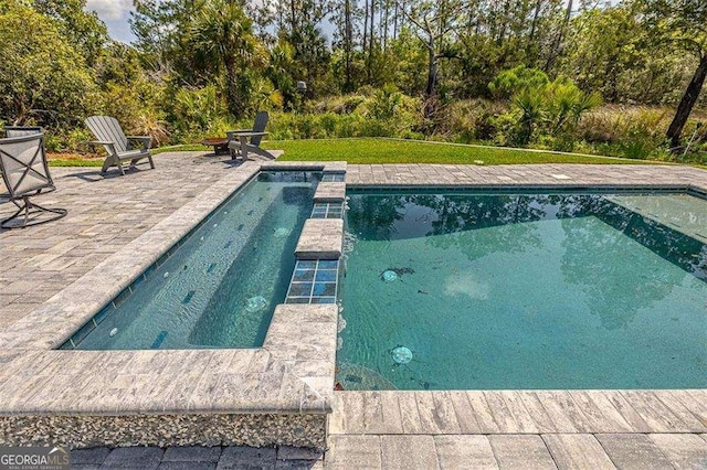 123 E Commons Dr, Saint Simons, GA 31522 - view of pool featuring a patio and a pool with connected hot tub