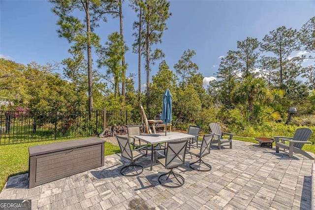 123 E Commons Dr, Saint Simons, GA 31522 - view of patio with an outdoor fire pit and outdoor dining area