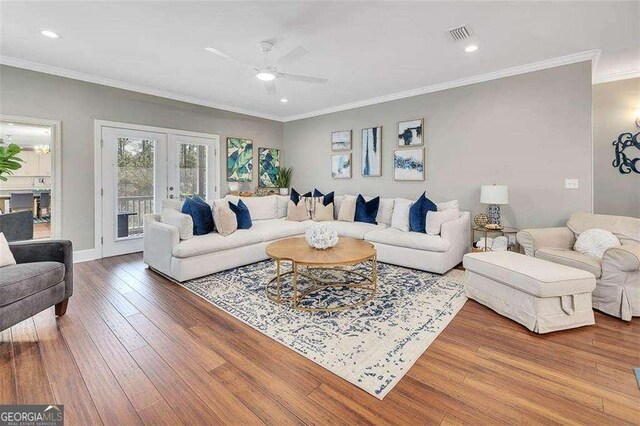 123 E Commons Dr, Saint Simons, GA 31522 - living area with french doors, hardwood / wood-style floors, ceiling fan, ornamental molding, and recessed lighting