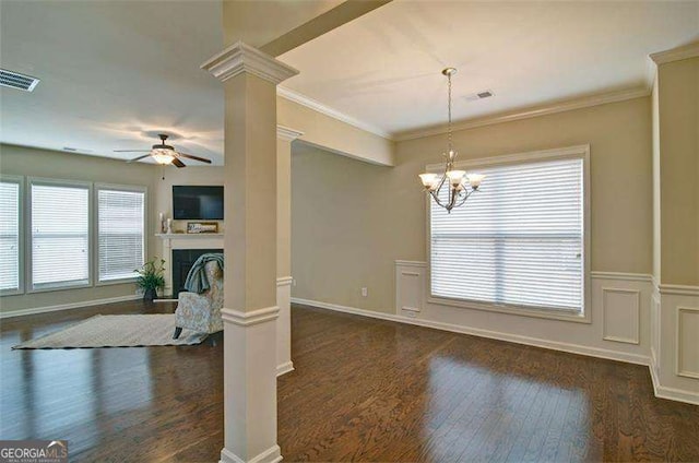 4854 Allston Ln, Peachtree Corners, GA 30092 - unfurnished dining area featuring crown molding, decorative columns, ceiling fan with notable chandelier, dark wood-type flooring, and visible vents