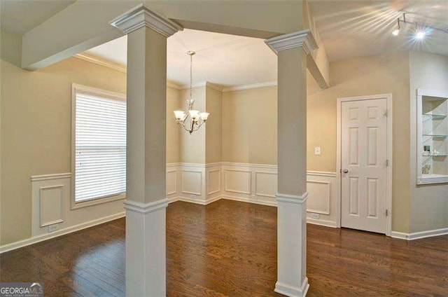 4854 Allston Ln, Peachtree Corners, GA 30092 - unfurnished dining area featuring dark wood-style flooring, a decorative wall, crown molding, and decorative columns