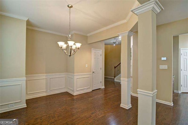 4854 Allston Ln, Peachtree Corners, GA 30092 - unfurnished dining area with wood finished floors, crown molding, stairs, an inviting chandelier, and wainscoting