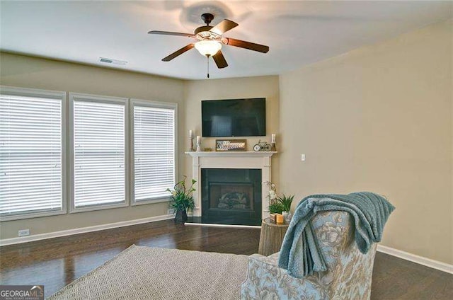 4854 Allston Ln, Peachtree Corners, GA 30092 - living room with a ceiling fan, plenty of natural light, a fireplace with raised hearth, and visible vents