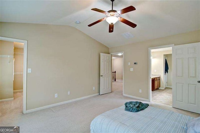 4854 Allston Ln, Peachtree Corners, GA 30092 - bedroom with a closet, a walk in closet, lofted ceiling, baseboards, and light colored carpet
