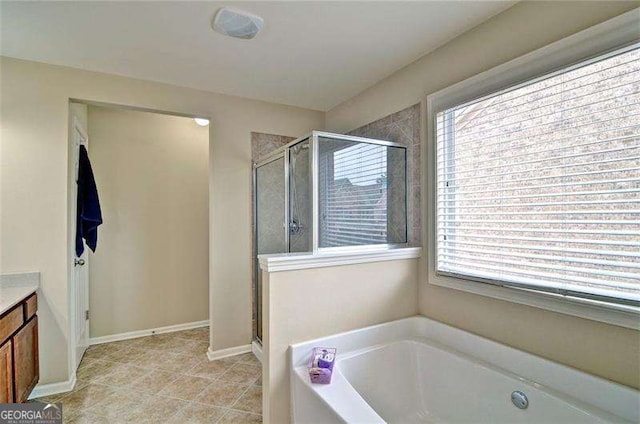 4854 Allston Ln, Peachtree Corners, GA 30092 - bathroom with tile patterned flooring, vanity, a stall shower, and a bath