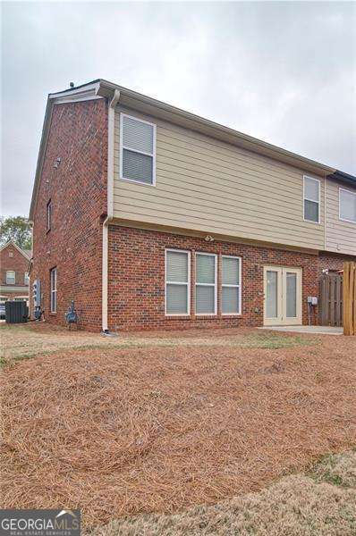 4854 Allston Ln, Peachtree Corners, GA 30092 - back of house featuring brick siding and fence