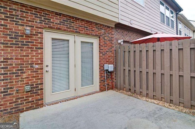 4854 Allston Ln, Peachtree Corners, GA 30092 - doorway to property with fence, brick siding, and a patio