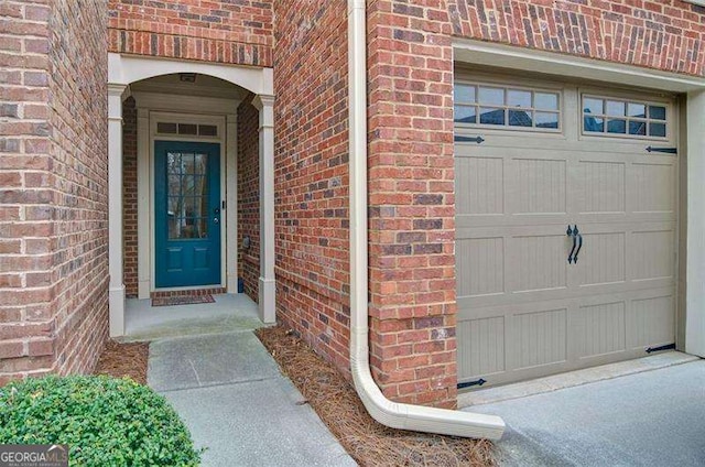 4854 Allston Ln, Peachtree Corners, GA 30092 - view of exterior entry with a garage and brick siding