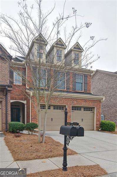 4854 Allston Ln, Peachtree Corners, GA 30092 - view of front facade featuring brick siding, concrete driveway, and a garage