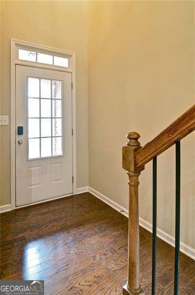 4854 Allston Ln, Peachtree Corners, GA 30092 - entryway with dark wood-type flooring and baseboards