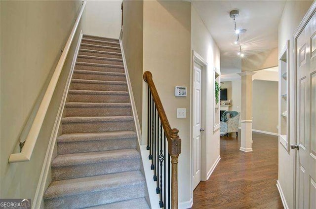 4854 Allston Ln, Peachtree Corners, GA 30092 - stairway with wood finished floors, baseboards, and ornate columns