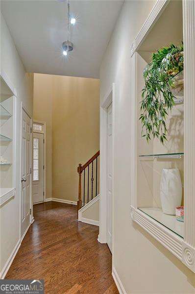 4854 Allston Ln, Peachtree Corners, GA 30092 - foyer entrance with baseboards, stairs, and wood finished floors