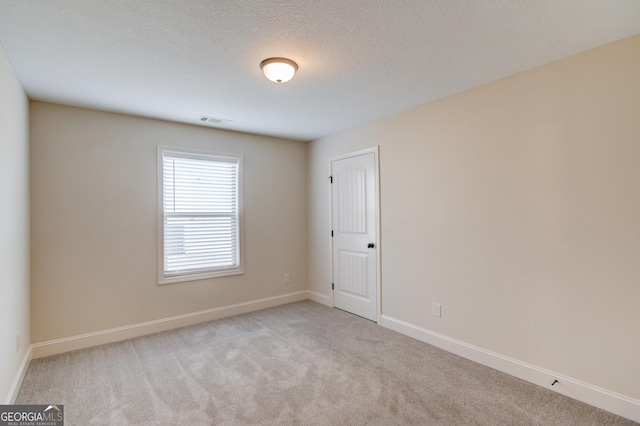174 Livingston Ct, Winder, GA 30680 - carpeted spare room with baseboards and a textured ceiling