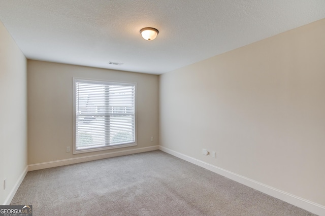174 Livingston Ct, Winder, GA 30680 - unfurnished room with carpet and a textured ceiling