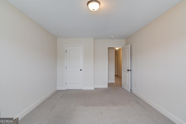 174 Livingston Ct, Winder, GA 30680 - unfurnished bedroom featuring light carpet and baseboards
