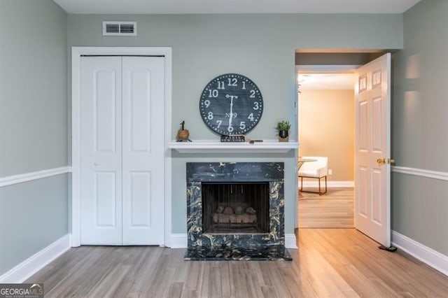 6851 Roswell Rd Unit A-12, Atlanta, GA 30328 - detailed view of wood finished floors, a premium fireplace, and baseboards
