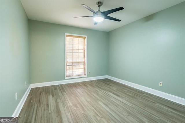 6851 Roswell Rd Unit A-12, Atlanta, GA 30328 - unfurnished room featuring wood finished floors, baseboards, and ceiling fan