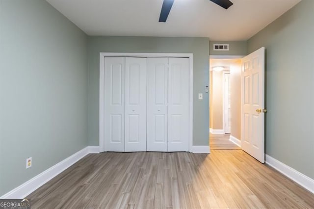 6851 Roswell Rd Unit A-12, Atlanta, GA 30328 - unfurnished bedroom with wood finished floors, baseboards, and a closet