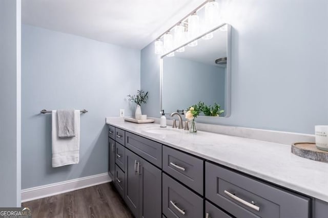 6851 Roswell Rd Unit A-12, Atlanta, GA 30328 - bathroom with vanity, wood finished floors, and baseboards