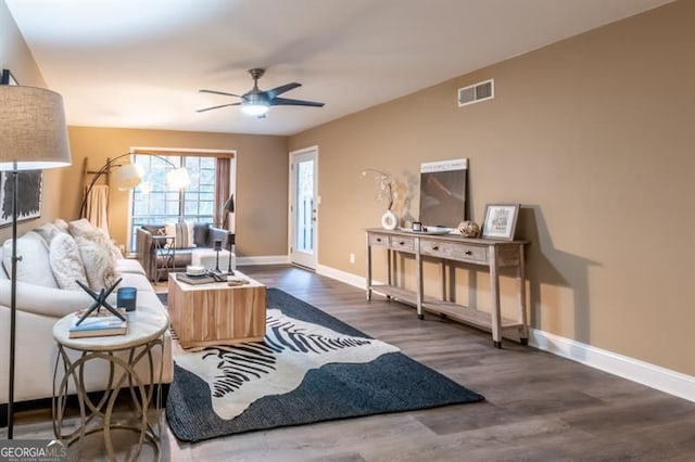 6851 Roswell Rd Unit A-12, Atlanta, GA 30328 - living area with wood finished floors, baseboards, and a ceiling fan