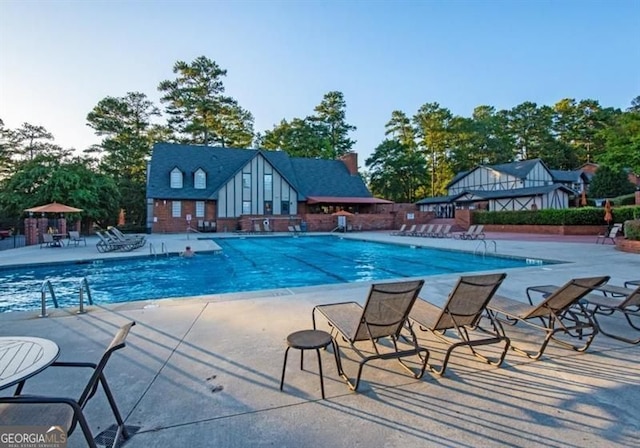 6851 Roswell Rd Unit A-12, Atlanta, GA 30328 - community pool with a patio area