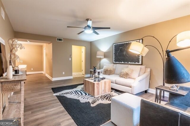 6851 Roswell Rd Unit A-12, Atlanta, GA 30328 - living area with a ceiling fan, wood finished floors, and baseboards