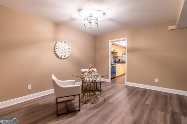 6851 Roswell Rd Unit A-12, Atlanta, GA 30328 - dining room featuring baseboards, dark wood-style floors, and a chandelier