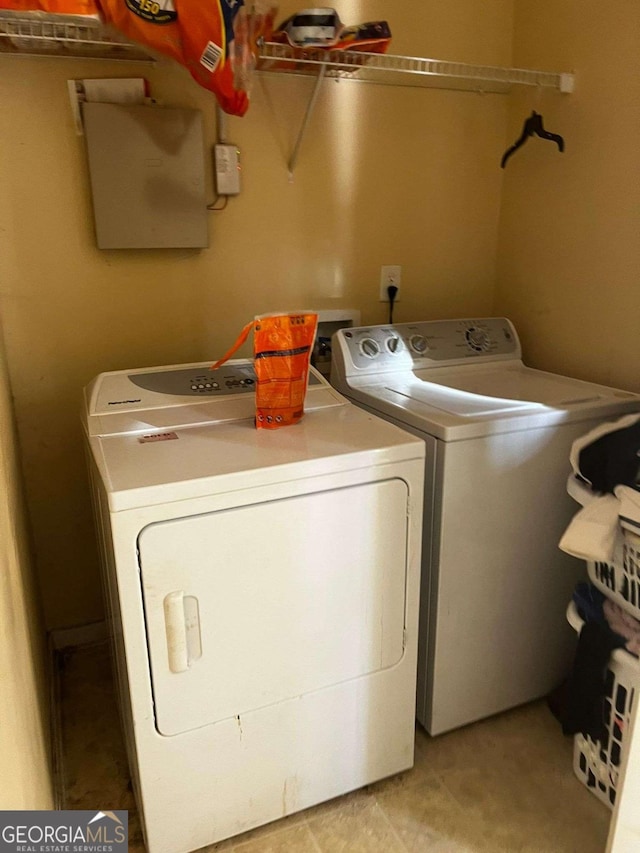 clothes washing area with independent washer and dryer