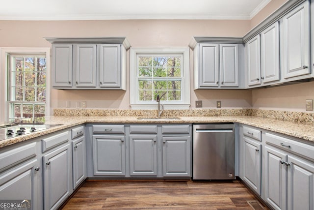 kitchen featuring a sink, crown molding, gray cabinetry, dark wood-type flooring, and stainless steel dishwasher