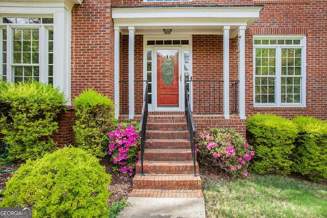 property entrance with brick siding