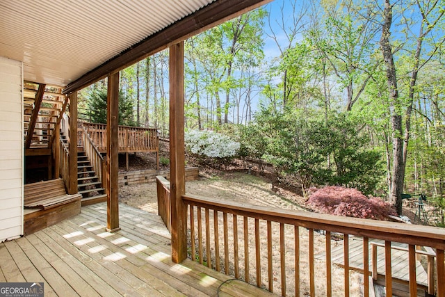 wooden deck featuring stairway