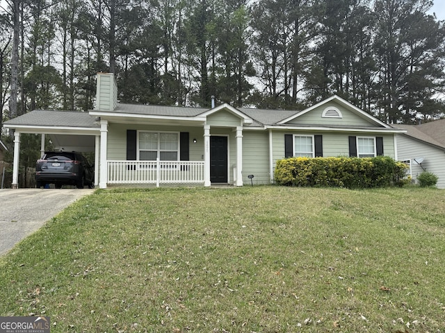 ranch-style house featuring a front yard, concrete driveway, a chimney, a carport, and a porch