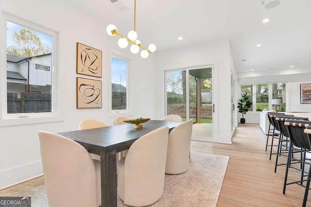 1598 Athens Ave SW, Atlanta, GA 30310 - dining room featuring plenty of natural light, light wood-type flooring, recessed lighting, and a chandelier