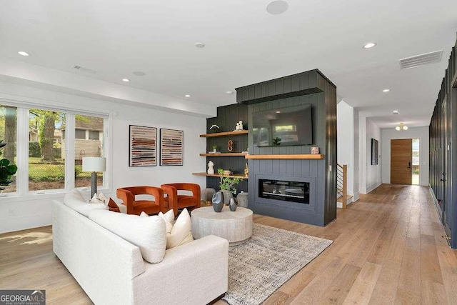 1598 Athens Ave SW, Atlanta, GA 30310 - living area featuring healthy amount of natural light, a fireplace, light wood-style flooring, and recessed lighting