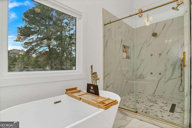 1598 Athens Ave SW, Atlanta, GA 30310 - full bath featuring marble look tile flooring, a soaking tub, a marble finish shower, and healthy amount of natural light