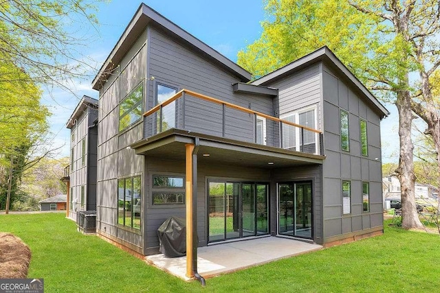 1598 Athens Ave SW, Atlanta, GA 30310 - back of house featuring a balcony, a yard, and a patio